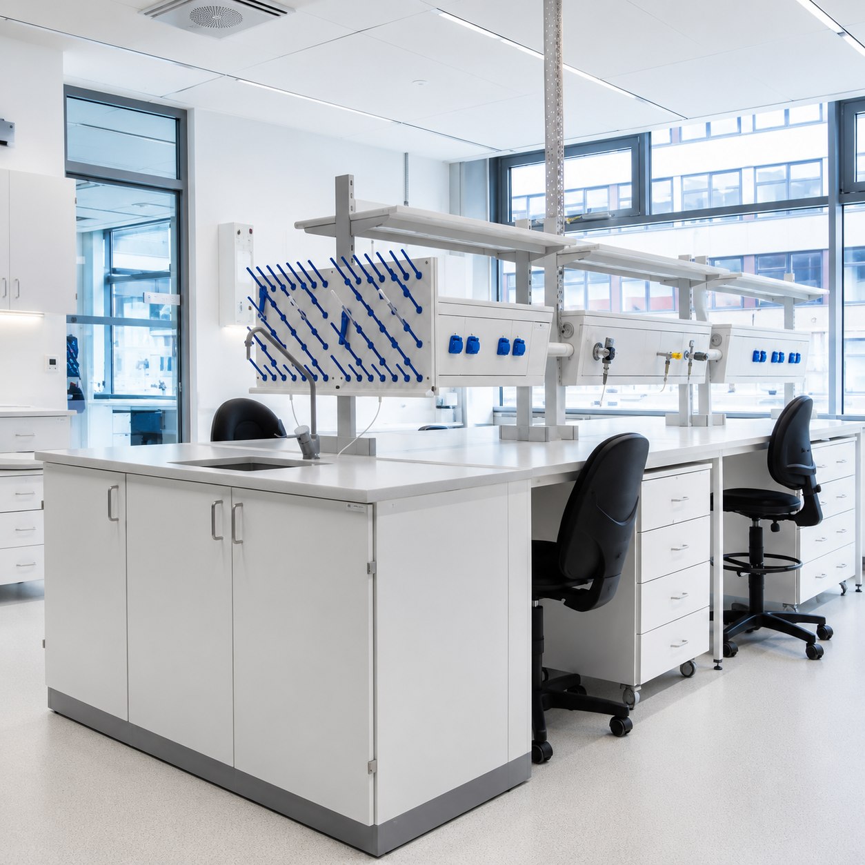 Laboratory fit-out — bench system with service spine and extraction arms